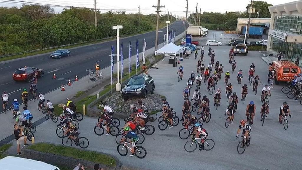 people cycling near Prestige Automobiles