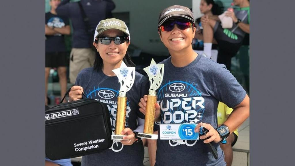 Subaru Superloop participants posing with their awards and prizes